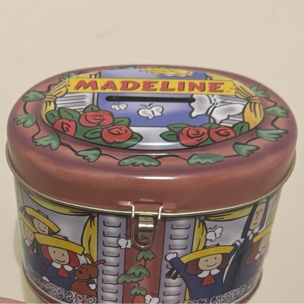 Vintage Madeline Savings Tin / Bank, includes a key